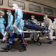 Medical staff transport a coronavirus patient at Austerlitz train station in Paris.